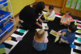 Load image into Gallery viewer, Rainbow Polka Dot Border Classroom Rug by Schoolgirl Style
