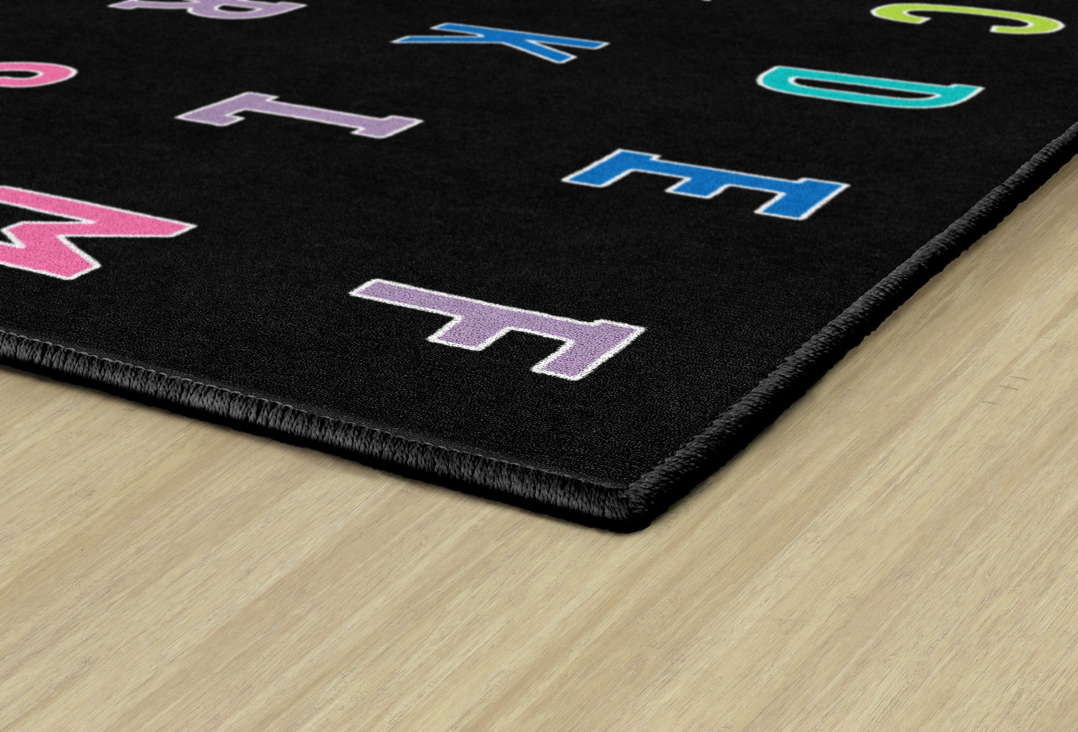 Rainbow Alphabet on Black Sit Spots Rug