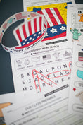 Load image into Gallery viewer, Educational materials about the Constitution with a word search and flag-themed design.