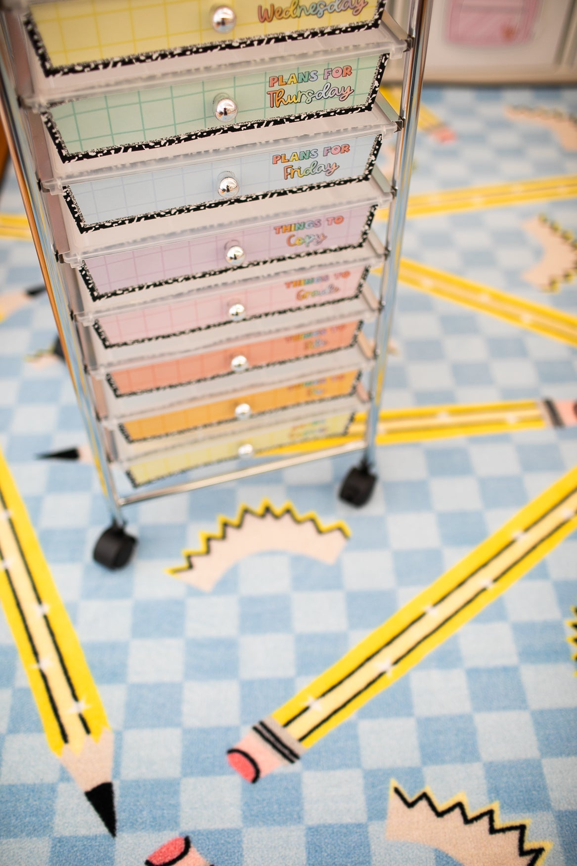 Pencils on Blue Checkerboard Rug