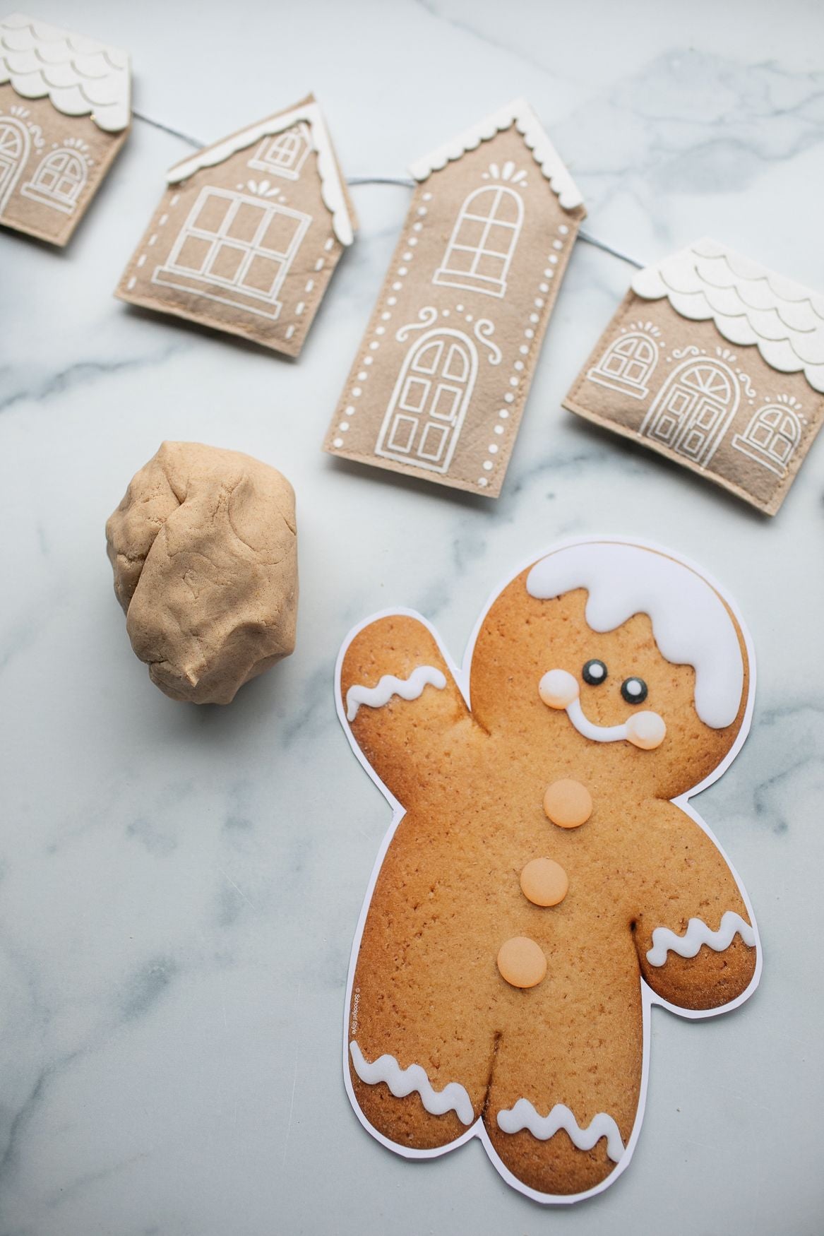 gingerbread play dough next to a gingerbread man