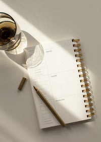 Family calendar or agenda book with pen