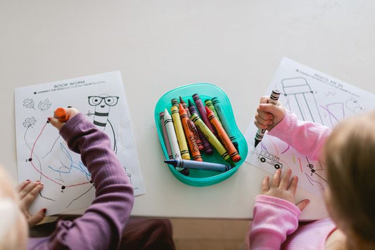 Kids working on developmentally appropriate worksheets