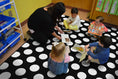 Load image into Gallery viewer, Black & White Polka Dot Classroom Rug by Schoolgirl Style
