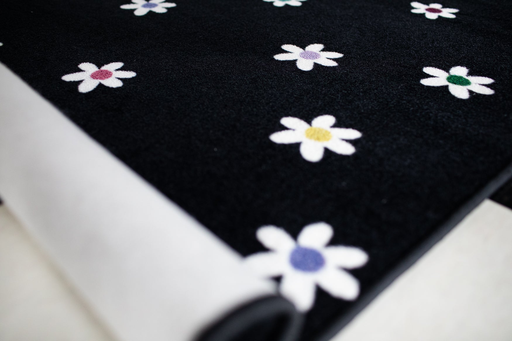 Small Daisies on Black Rug