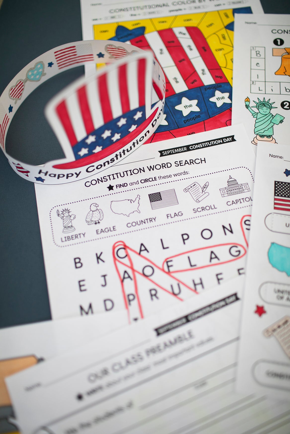 Educational materials about the Constitution with a word search and flag-themed design.