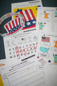 Load image into Gallery viewer, Educational materials about the Constitution with a focus on American flag and patriotic elements.

