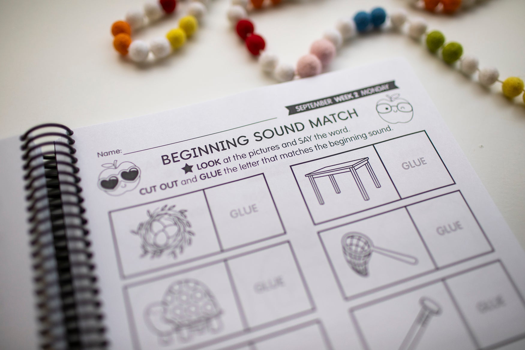 Educational worksheet titled 'Beginning Sound Match' with pictures and letter outlines on a white surface.