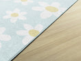 Load image into Gallery viewer, white daisies on a pastel blue rug
